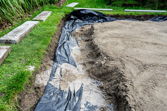 Ground preparation for backyard patio paving work