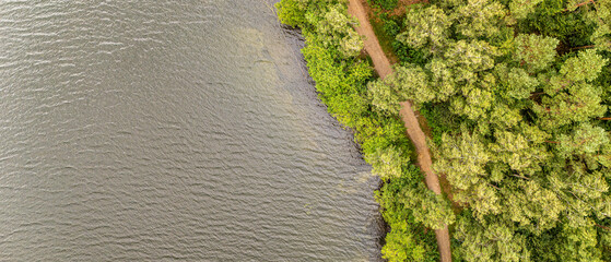Top down view of forest path along lake shore © Quality by Simon
