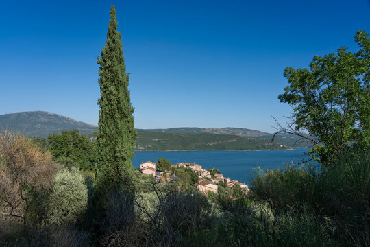Sainte-Croix-du-Verdon, France - 07 05 2026: Panoramic view of Sainte-Croix-du-Verdon village, the Lake Sainte-Croix , hills and forest behind