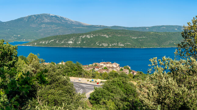 Sainte-Croix-du-Verdon, France - 07 05 2026: Panoramic view of Sainte-Croix-du-Verdon village, the Lake Sainte-Croix , hills and forest behind