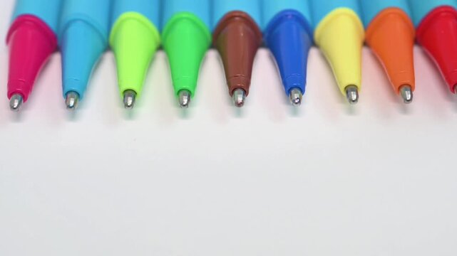 Colorful Ballpoint Pen Tips on White with Copy Space