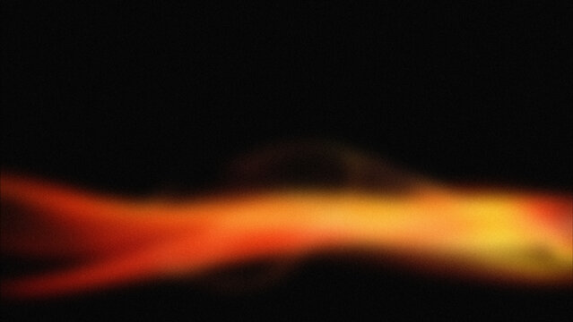 Bright orange and yellow flame on dark background