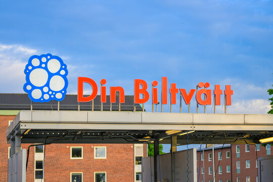 Gothenburg, Sweden - June 04 2026: Large Swedish car wash sign above urban service station.