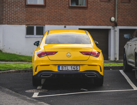 Gothenburg, Sweden - June 04 2026: Yellow Mercedes Benz CLA parked in residential lot.