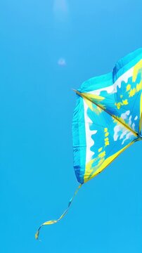 Flying colorful kite clear blue sky