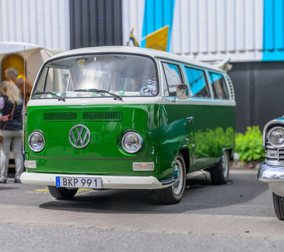 Gothenburg, Sweden - May 30 2026: Green and white Volkswagen Type 2 bus parked at outdoor car show.