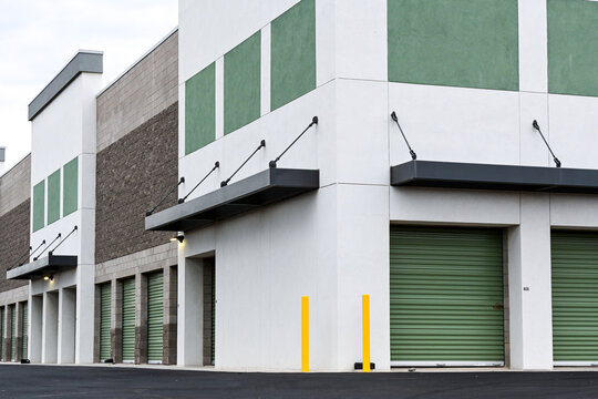 Modern self-storage facility with exterior drive-up storage units, roll-up doors, and secure rental spaces, illustrating the self-storage industry and commercial property operations