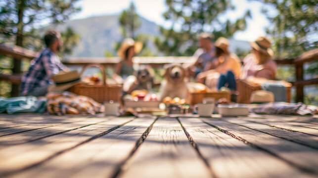 Low Perspective Blurred Picnic Gathering with Adults and Dogs on a Sunny Wooden Deck for Summer Pet Lifestyle Advertising