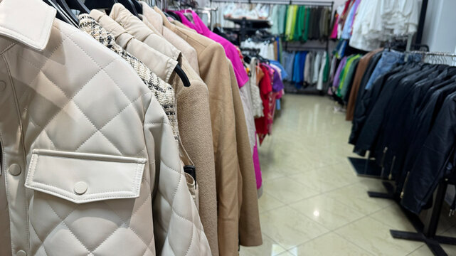 Modern Fashion Boutique Interior Featuring Stylish Clothing Racks And Luxury Apparel Collections