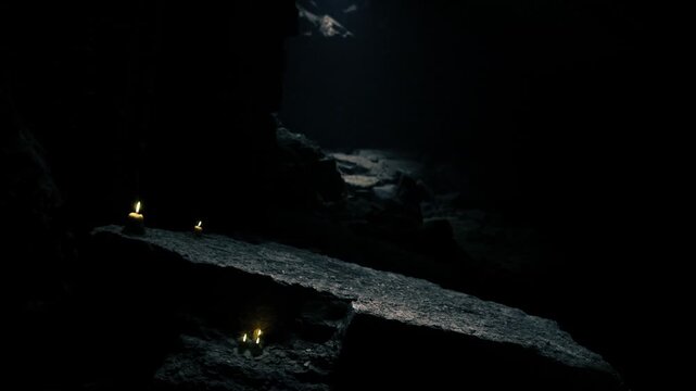 Mystic subterranean passage lit by scattered candles along narrow ledges, low ceiling and distant opening hint escape route, damp stones reflect faint golden