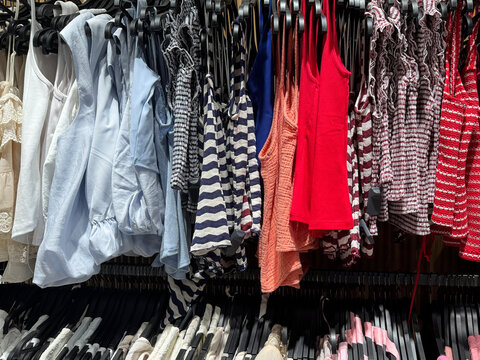 Stylish Boutique Clothing Rack Featuring Colorful Casual Dresses And Summer Fashion Collections