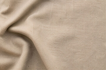 Fototapeta premium Natural beige linen fabric texture background with soft folds and blank copy space for product mockup