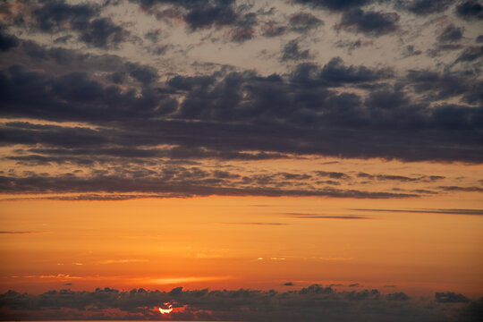 Beautiful summer sunset sky colorful clouds.