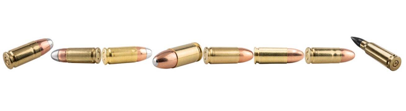 Row of shiny metallic gun bullets isolated on white background