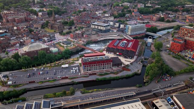 Aerial view of Rotherham town centre in South Yorkshire, UK at sunset with high street shopping and vibrant community along the River Rother and Forge Island