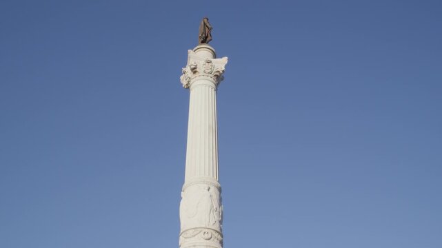Low Angle View of Restauradores Monument in Lisbon Portugal During Summer Golden Hour Shot with Cinema Camera