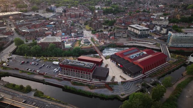 Aerial view of Rotherham town centre in South Yorkshire, UK at sunset with high street shopping and vibrant community along the River Rother and Forge Island