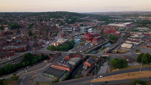 Aerial view of Rotherham town centre in South Yorkshire, UK at sunset with high street shopping and vibrant community along the River Rother and Forge Island