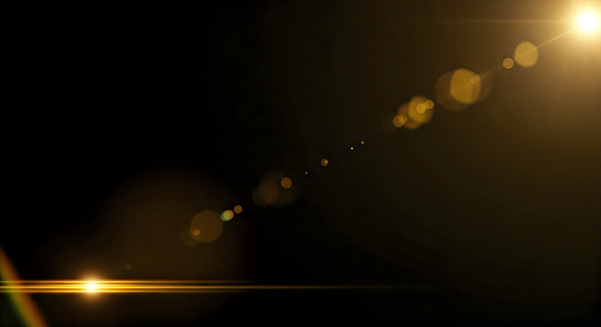 A bright golden sun flare effect isolated on a black background creating a cinematic light leak for professional video and graphic design projects