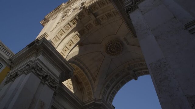 Low Angle View Beneath Rua Augusta Arch in Lisbon Portugal During Summer Golden Hour Shot with Cinema Camera