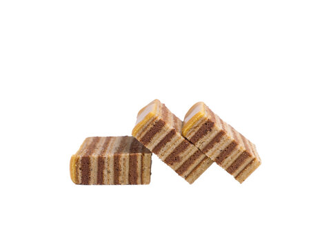 Isolated Group of Three Slices of Indonesian Lapis Legit Layer Cake or Spekkoek Arranged Together

