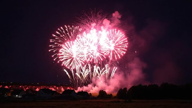 Bright Fireworks Exploding Over Suburb at Night Creating Beautiful Festive Display During Celebration and Festivities