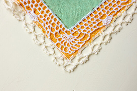 Decorative lace edged textile napkin corner
