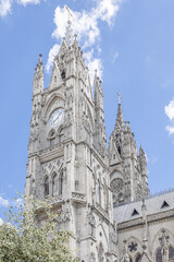 Fototapeta premium View of the Basilica of the National Vow and the Clock Towers, a neo-Gothic church in Quito’s historic center, renowned for gargoyles depicting native fauna.