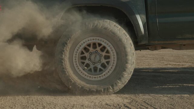 truck doing burnout in desert