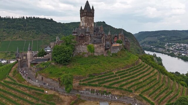 People and Clouds moving over Reichsburg Cochem above the Moselle valley Timelapse