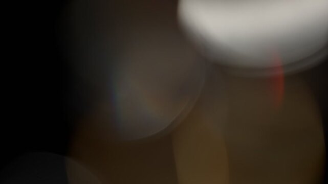Light organic leaks effect background animation stock footage. Lens light leaks flashing around making an elegant abstract background animation. Classic Light Leak in 4k