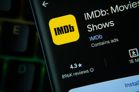 Seattle, United States - 24 July 2026: IMDb app page on Google Play Store is seen on a smartphone screen.