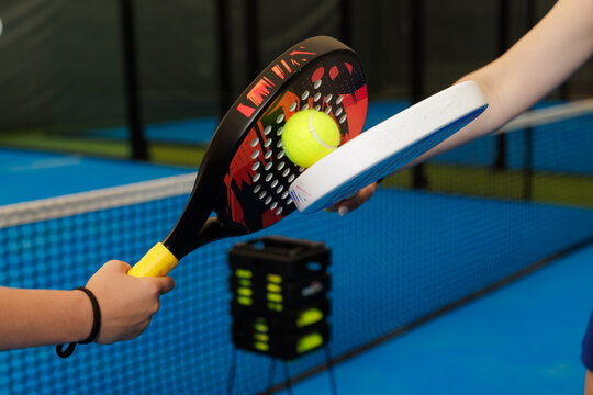 Padel Tennis Coaching Session with Rackets and Ball Interaction
