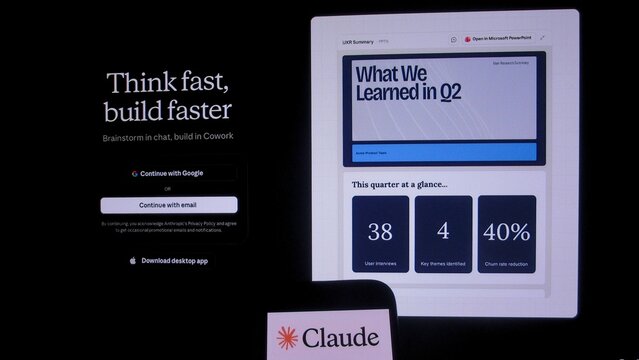 Nova Lima, Brazil &ndash; July 23, 2026: Claude AI chatbot logo on a smartphone display in front of a computer monitor showing data analytics and productivity software interfaces.
