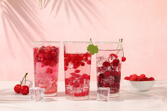 Dietary vegan water with raspberries, currants, and cherries, detox water, mojito with Sprite, mint and fresh berries. Detox diet and weight loss concept,healthy lifestyle advertising,menus for cafes