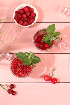 Mojito with sprite, mint and fresh berries,Detox water with raspberries, cherries, and currants, over ice. A refreshing summer homemade lemonade cocktail. Fruit juice and ingredients,