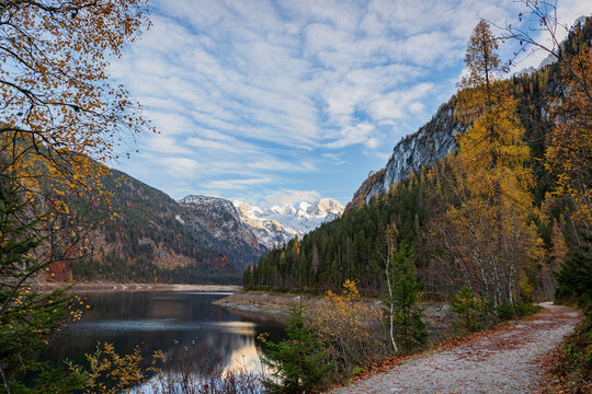 Colourful autumn view of the Gosau lake (Upper Gosausee) with tourist walkway. Austria
