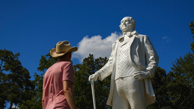Person standing in front of the giant Sam Houston statue in Huntsville, Texas USA