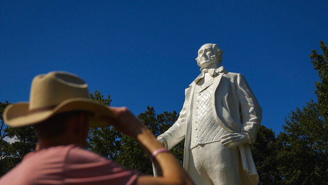 Person standing in front of the giant Sam Houston statue in Huntsville, Texas USA