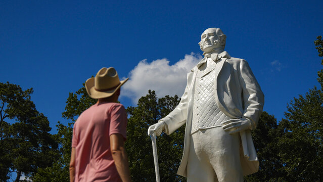 Person standing in front of the giant Sam Houston statue in Huntsville, Texas USA