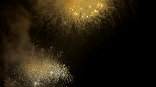 Fireworks, real beautiful colorful fireworks background, celebration, night event party, festivals, abstract multi color golden firework in the night sky, glowing trails and a festive glow