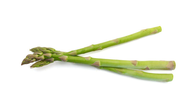 Fresh green asparagus on white