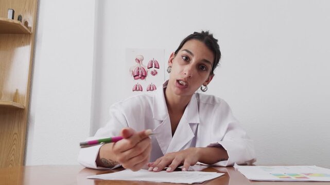 Young latina doctor explaining diagnosis during online video call