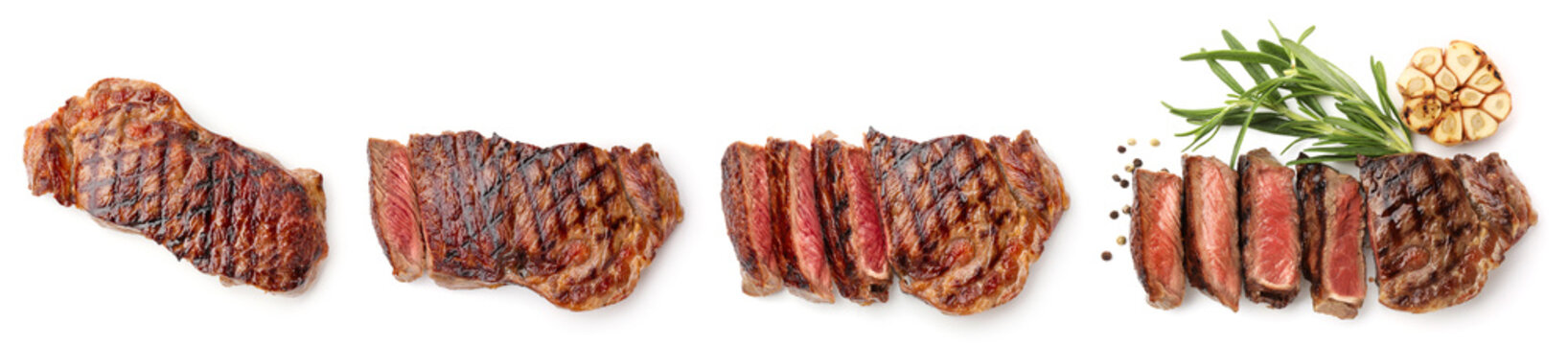 Delicious meat steaks isolated on white, set. Top view