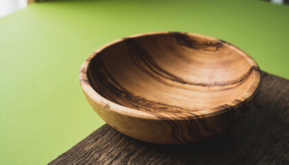 Obraz premium Close Up of Wooden Bowl on Rustic Table.