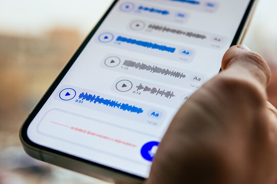 A person recording voice messages in a messenger.