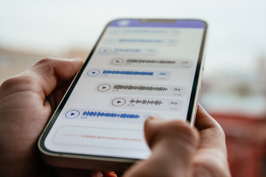 A person recording voice messages in a messenger.