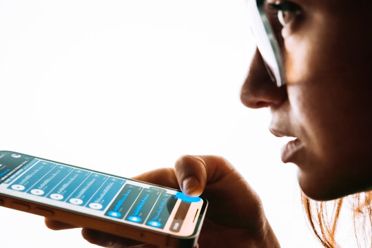 A person recording voice messages in a messenger.