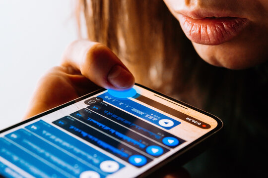 A person recording voice messages in a messenger.