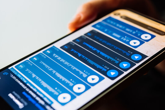 A person recording voice messages in a messenger.
